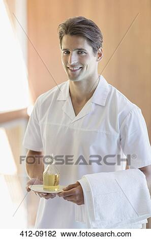 Masseuse carrying pitcher of oil at spa View Large Photo Image Stock Image - Masseuse carrying pitcher of oil at spa. Fotosearch