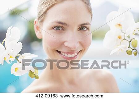 Orchids around smiling woman View Large Photo Image Stock Image - Orchids around smiling woman. Fotosearch