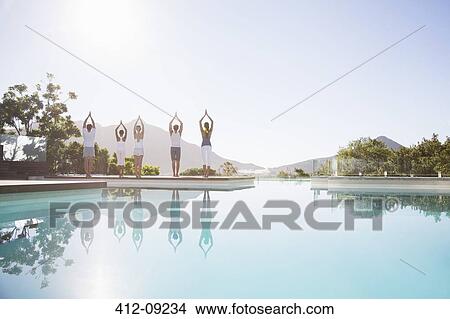 People practicing yoga at poolside View Large Photo Image Picture - People practicing yoga at poolside. Fotosearch