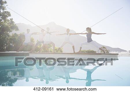 People practicing yoga at poolside View Large Photo Image Stock Image - People practicing yoga at poolside. Fotosearch
