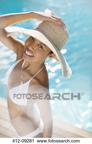 Portrait of smiling woman at poolside View Large Photo Image Stock Image - Portrait of smiling woman at poolside. Fotosearch