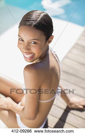 Portrait of smiling woman at poolside View Large Photo Image Stock Photograph - Portrait of smiling woman at poolside. Fotosearch