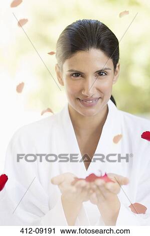 Portrait of smiling woman holding rose petals View Large Photo Image Stock Image - Portrait of smiling woman holding rose petals. Fotosearch