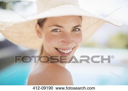 Portrait of smiling woman in sun hat View Large Photo Image Stock Image - Portrait of smiling woman in sun hat. Fotosearch