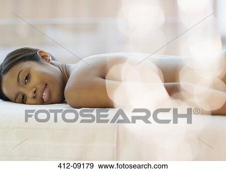 Portrait of smiling woman laying on massage table View Large Photo Image Stock Photo - Portrait of smiling woman laying on massage table. Fotosearch