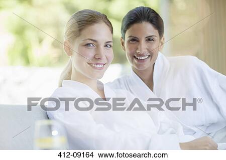 Portrait of smiling women in bathrobes at spa View Large Photo Image Picture - Portrait of smiling women in bathrobes at spa. Fotosearch