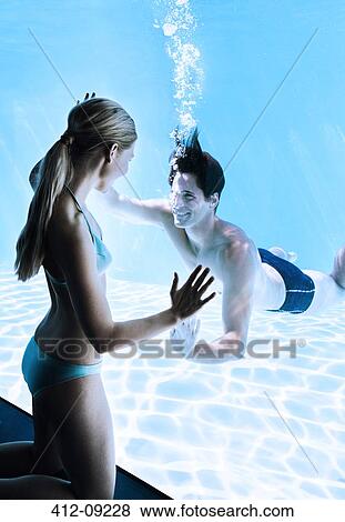 Woman at window smiling at man underwater View Large Photo Image Stock Photo - Woman at window smiling at man underwater. Fotosearch