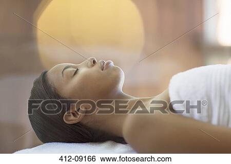 Stock Photograph - Woman having massage at spa. Fotosearch