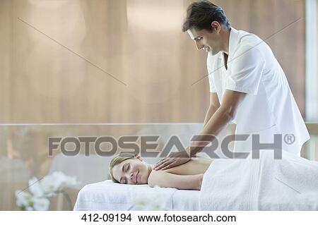 Woman receiving massage at spa View Large Photo Image Picture - Woman receiving massage at spa. Fotosearch
