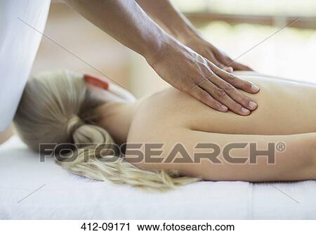 Woman receiving massage at spa View Large Photo Image Stock Image - Woman receiving massage at spa. Fotosearch