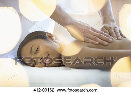 Woman receiving massage View Large Photo Image Stock Image - Woman receiving massage. Fotosearch