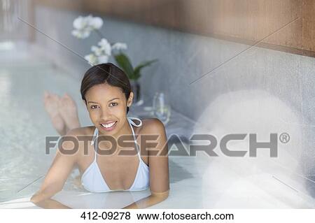 Woman relaxing in spa pool View Large Photo Image Stock Photo - Woman relaxing in spa pool. Fotosearch
