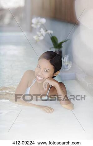 Woman smiling in hot tub at spa View Large Photo Image Picture - Woman smiling in hot tub at spa. Fotosearch