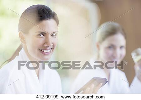 Woman using digital tablet at spa View Large Photo Image Stock Photo - Woman using digital tablet at spa. Fotosearch