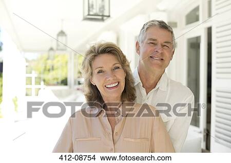 Portrait of senior couple smiling on porch View Large Photo Image Picture - Portrait of senior couple smiling on porch. Fotosearch
