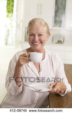 Portrait of senior woman drinking coffee View Large Photo Image Stock Photography - Portrait of senior woman drinking coffee. Fotosearch