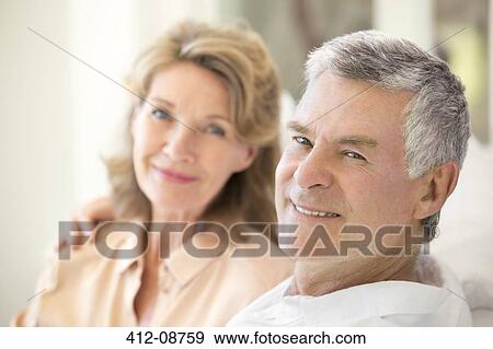 Stock Photo - Portrait of smiling senior couple. Fotosearch