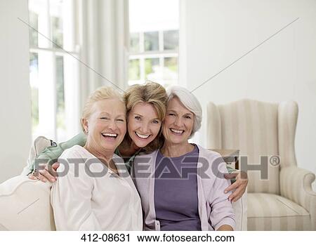 Portrait of smiling senior women in livingroom View Large Photo Image Stock Image - Portrait of smiling senior women in livingroom. Fotosearch