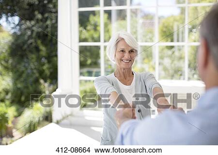 Senior couple dancing on patio View Large Photo Image Picture - Senior couple dancing on patio. Fotosearch