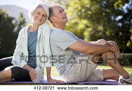 Senior couple sitting on yoga mat in park View Large Photo Image Stock Image - Senior couple sitting on yoga mat in park. Fotosearch