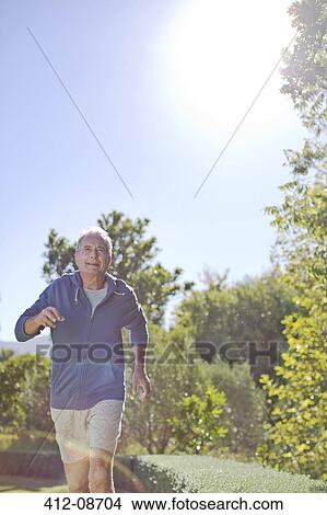 Senior man running in park View Large Photo Image Picture - Senior man running in park. Fotosearch