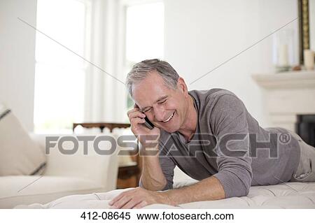 Stock Photography - Senior man talking on cell phone. Fotosearch