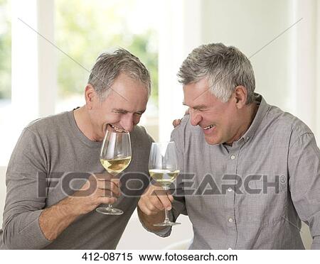 Senior men laughing and drinking white wine View Large Photo Image Stock Photography - Senior men laughing and drinking white wine. Fotosearch