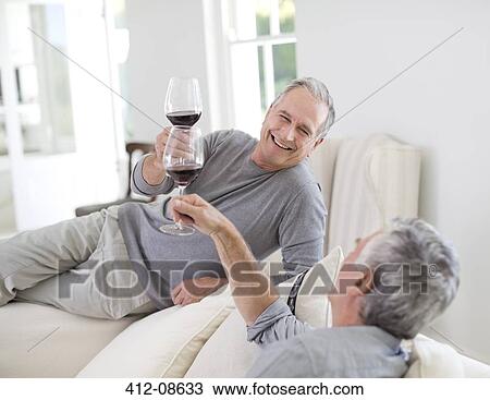 Senior men toasting wine glasses View Large Photo Image Stock Image - Senior men toasting wine glasses. Fotosearch