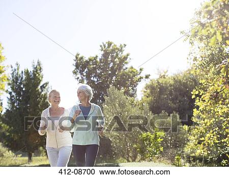Senior women jogging in park View Large Photo Image Stock Image - Senior women jogging in park. Fotosearch
