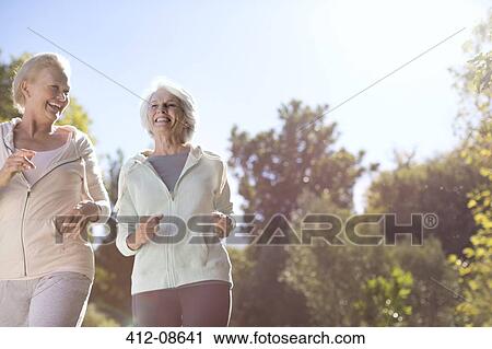 Senior women running outdoors View Large Photo Image Stock Image - Senior women running outdoors. Fotosearch