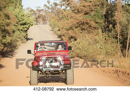 Couple driving sport utility vehicle on dirt road View Large Photo Image Stock Image - Couple driving sport utility vehicle on dirt road. Fotosearch