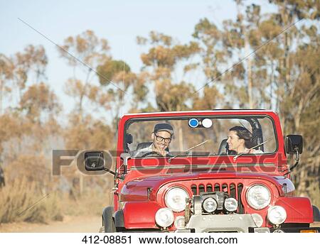 Couple driving sport utility vehicle View Large Photo Image Stock Image - Couple driving sport utility vehicle. Fotosearch