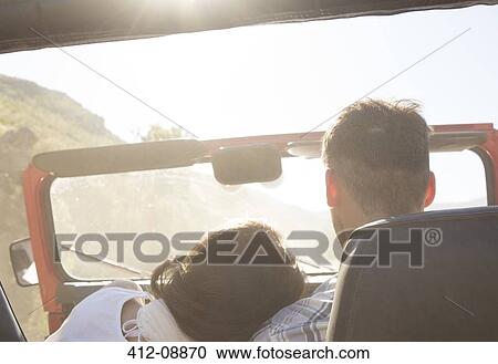 Couple driving sport utility vehicle View Large Photo Image Stock Image - Couple driving sport utility vehicle. Fotosearch