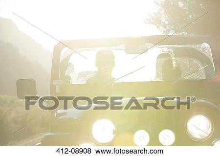 Couple driving sport utility vehicle View Large Photo Image Stock Photo - Couple driving sport utility vehicle. Fotosearch