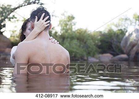 Couple hugging in lake View Large Photo Image Stock Photo - Couple hugging in lake. Fotosearch