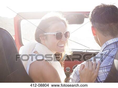 Couple in sport utility vehicle View Large Photo Image Picture - Couple in sport utility vehicle. Fotosearch
