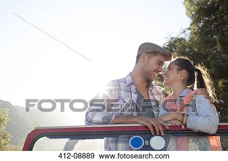 Couple rubbing noses in sport utility vehicle View Large Photo Image Stock Photo - Couple rubbing noses in sport utility vehicle. Fotosearch