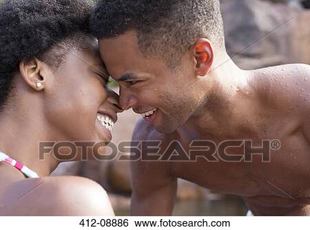 Stock Photograph - Couple smiling outdoors. Fotosearch