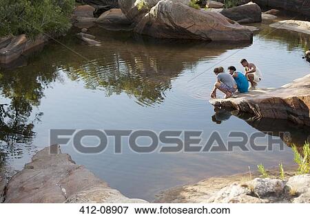 Friends at edge of pool View Large Photo Image Stock Photo - Friends at edge of pool. Fotosearch
