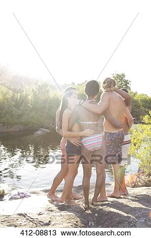 Friends hugging at riverside View Large Photo Image Stock Image - Friends hugging at riverside. Fotosearch