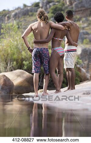 Friends hugging riverside View Large Photo Image Stock Photo - Friends hugging riverside. Fotosearch