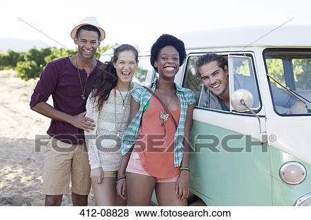 Friends laughing by camper van View Large Photo Image Stock Photo - Friends laughing by camper van. Fotosearch
