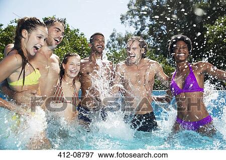 Friends playing in swimming pool View Large Photo Image Stock Photo - Friends playing in swimming pool. Fotosearch