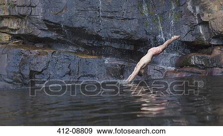 Man diving into lake View Large Photo Image Stock Photo - Man diving into lake. Fotosearch