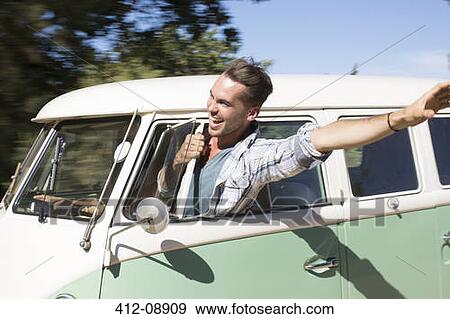 Man leaning head out camper van window View Large Photo Image Stock Photo - Man leaning head out camper van window. Fotosearch