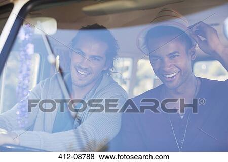 Men smiling in camper van View Large Photo Image Stock Photo - Men smiling in camper van. Fotosearch