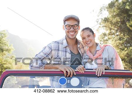 Portrait of smiling couple in sport utility vehicle View Large Photo Image Stock Image - Portrait of smiling couple in sport utility vehicle. Fotosearch