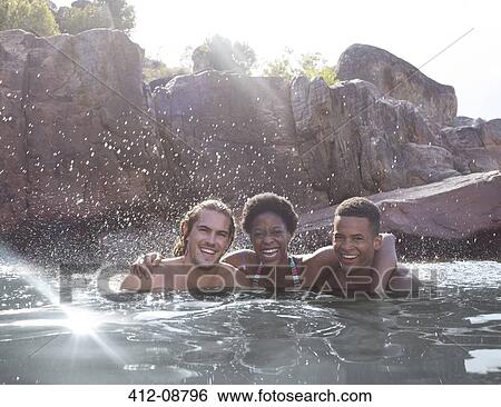 Portrait of smiling friends in river View Large Photo Image Stock Photograph - Portrait of smiling friends in river. Fotosearch