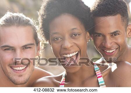 Stock Image - Portrait of smiling friends. Fotosearch