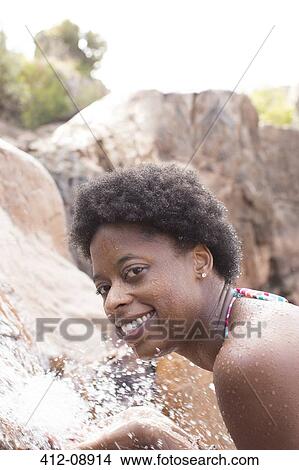 Portrait of smiling woman at waterfall View Large Photo Image Picture - Portrait of smiling woman at waterfall. Fotosearch